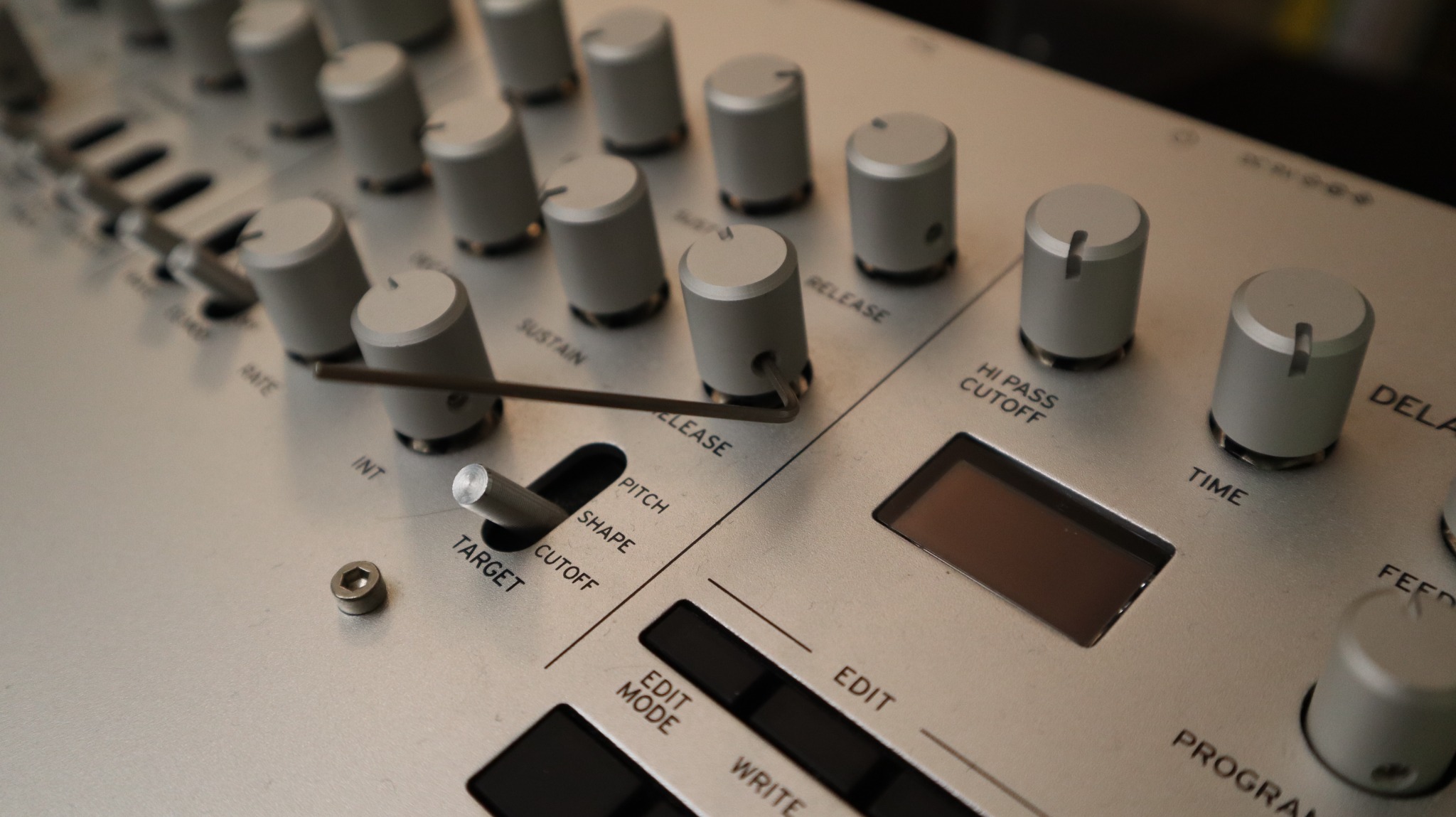 Replacement knobs installed on a Korg Minilogue with the included hex key resting across the panel.